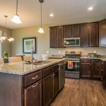 Large cabinets and large kitchen island inside a Motz built home in St. Johns, Michigan