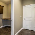 Laundry and entry to garage in new home in St. Johns Woodridge subdivision