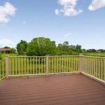 Composite deck and a beautiful view outside new St. Johns home