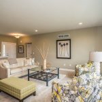 Entryway and living room inside new home in St. Johns, MI