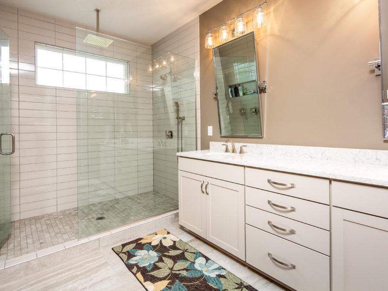 Huge master bathroom with tile shower and wide double sink counter