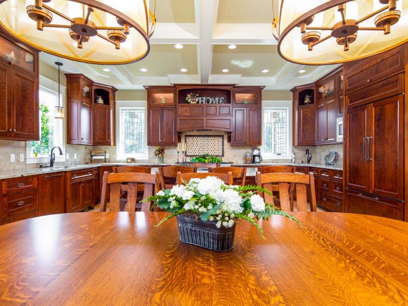 View of kitchen from dining table with coffered ceilings above