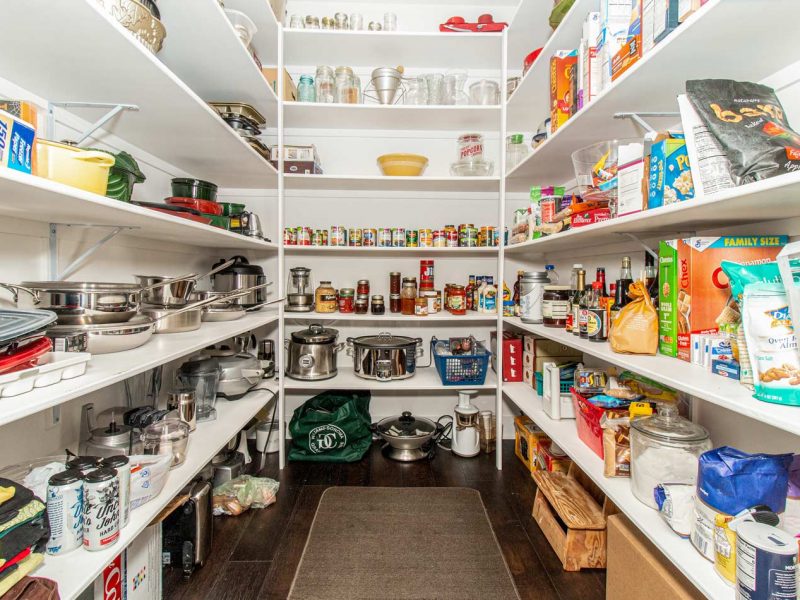 Huge walk-in pantry with floor to ceiling shelves